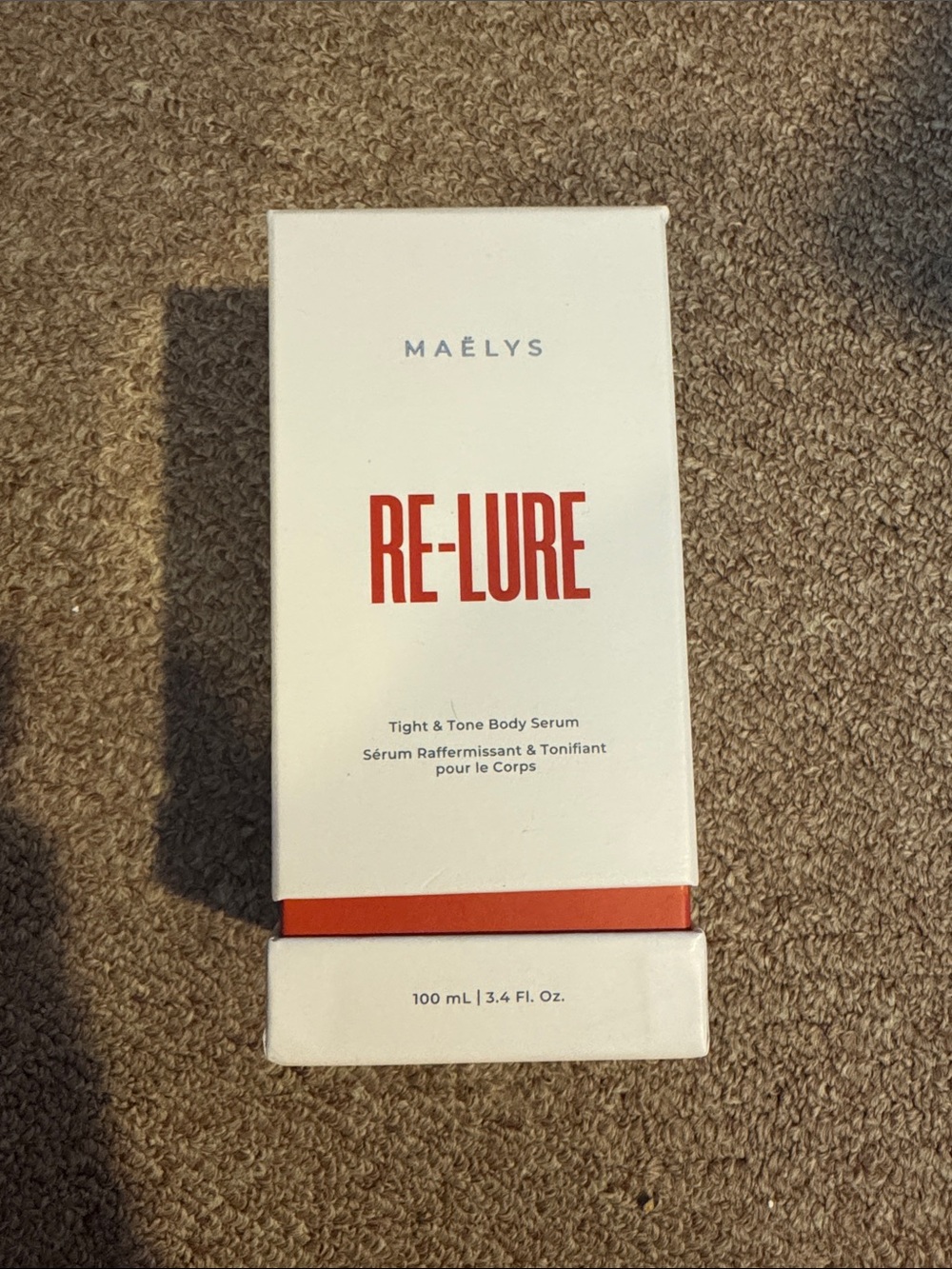 MAËLYS RE-LURE Tight & Tone Body Serum — White with Red Accent